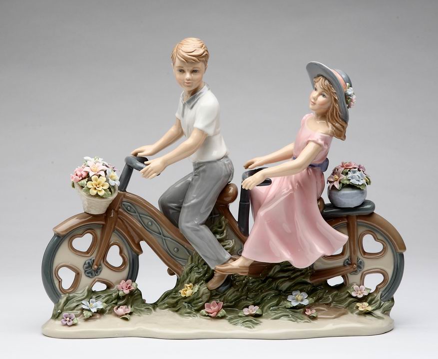 Young Couple Sharing Bike Figurine - kevinsgiftshoppe